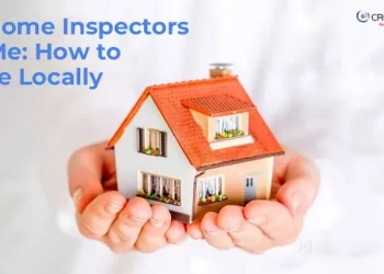 Man Holding a dummy house in hand and a question on the left top of the image says Best Home Inspectors Near Me: How to Choose Locally
