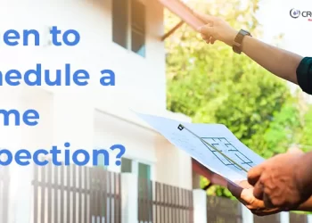 Two people reviewing a house plan while pointing at a residential property, with the text "When to Schedule a Home Inspection?" displayed prominently on the left.
