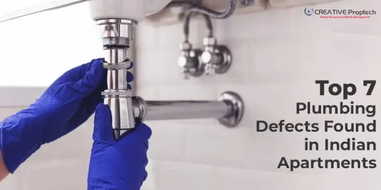 Plumber wearing blue gloves tightening a sink pipe under a washbasin; text overlay reads 'Top 7 Plumbing Defects Found in Indian Apartments' with CREATIVE Proptech logo in the corner.