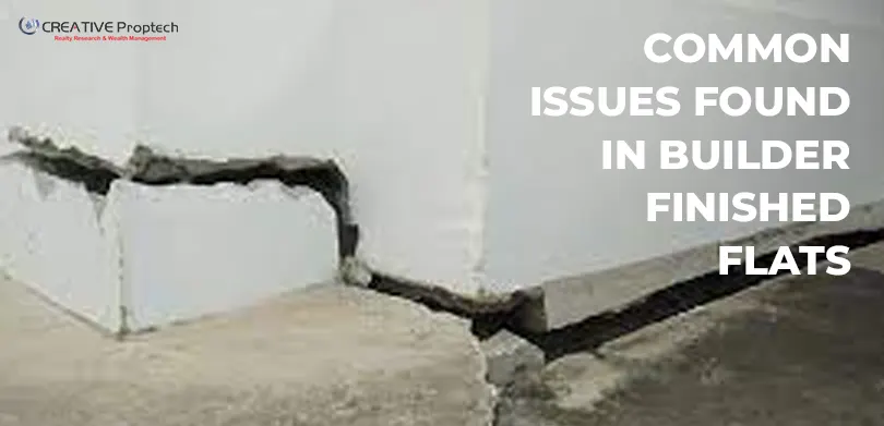 Close-up image of a cracked or damaged concrete foundation at the base of a white wall, illustrating common issues found in builder finished flats and new apartments.