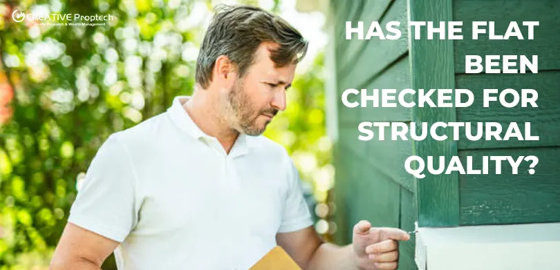 Home inspector examining exterior wall cracks of a green house while holding a clipboard with text on the right overlay reads Has the flat been checked for structural quality?'with CREATIVE Proptech logo.