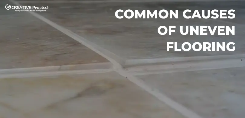 Close-up of poorly installed, uneven floor tiles with misaligned grout lines, illustrating the Common Causes of Uneven Flooring in a new apartment.