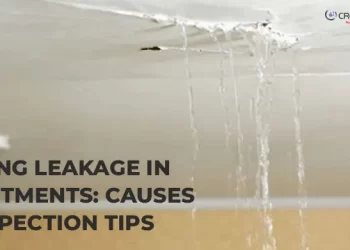 Severe water damage and active leakage through an apartment ceiling, emphasizing the need for inspection to find the causes of ceiling leaks.